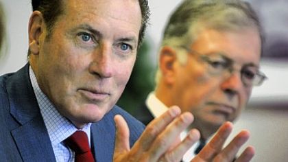 Kenneth Melani, president and CEO of Highmark, left, and David McClenehan, chairman of the board of West Penn Allegheny Health System, speak on Tuesday to the editorial board at the Post-Gazette.