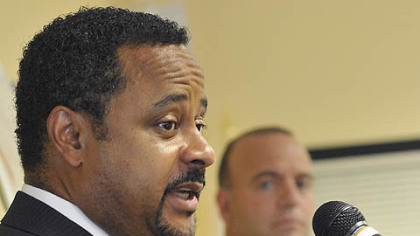 Brian A. Hudson, Sr., executive director and CEO of the Pennsylvania Housing Finance Agency, answers questions Monday at a news conference about aid to homeowners facing foreclosure.  In the background is Allegheny County Executive Dan Onorato.