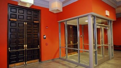 Center, right: The auditorium lobby was opened up and a glass vestibule added.