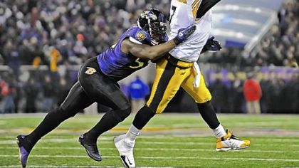 Steelers quarterback Ben Roethlisberger shuffles a pass out of bounds and avoids a sack by the Ravens Terrell Suggs late in the game between the two teams in November in Baltimore. Roethlisberger's play preserved what became the game-winning drive for the Steelers.