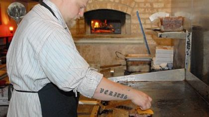 Zach Winghart of Winghart's Burger and Whiskey Bar. "Veritas" is Latin for "truth."