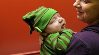 Becky Stratman of Squirrel Hill with 1-month-old son Xavier after he received a hepatitis vaccination.
