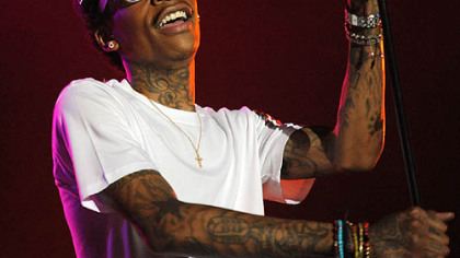 Hometown rapper Wiz Khalifa performs before a sold-out audience.
