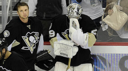 Penguins goaltender Marc-Andre Fleury collects himself next to teammate Brent Johnson after losing to the Lightning Wednesday at Consol Energy Center.
