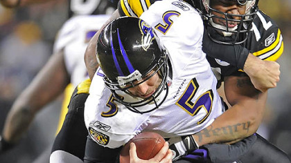 The Steelers' James Harrison sacks Ravens quarterback Joe Flacco.