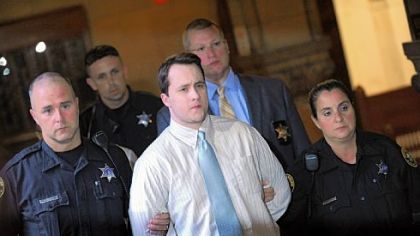 Richard Poplawski is escorted from the courtroom Tuesday after he was sentenced to death at the Allegheny County Courthouse.