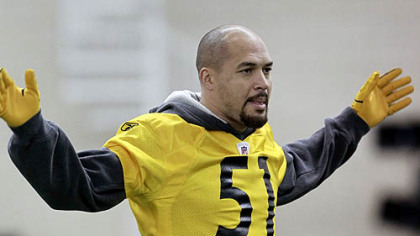 Steelers linebacker James Farrior stretches during practice Thursday in Fort Worth.