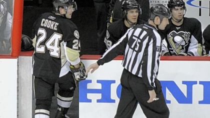 Penguins winger Matt Cooke is escorted from the ice by NHL linesman Derek Amell after Mr. Cooke was ejected for elbowing New York Rangers defenseman Ryan McDonagh in the head in the third period Sunday at Consol Energy Center. Monday, the league hit Mr. Cooke with a lengthy suspension.