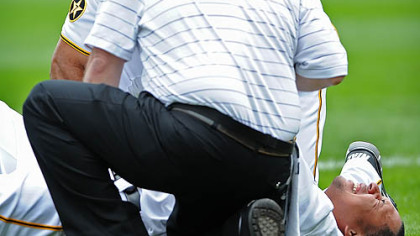 Jose Tabata is tended to after being injured.