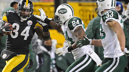 Rashard Mendenhall picks up a first down against the Jets in the first half of the AFC championship Sunday at Heinz Field.