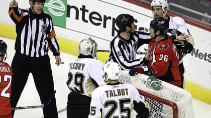 Washington Capitals center Matt Hendricks (26) argues with referees over a call in the second period.