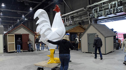 Farm Show vendors walk, roll drag and ride displays from  the floor of the exhibition hall at the close of the 95th annual Pennsylvania Farm Show.