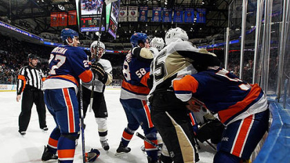 The Islanders and the Penguins fight during the second period of Friday's game at Nassau Coliseum in Uniondale, New York.