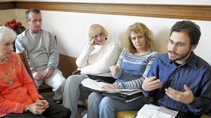 From left: June Beal, Michael Long, Joan John and Marigrace Butela, all of Dunbar, listen as Adam Garber speaks at a workshop Saturday hosted by the PennEnvironment Research and Policy Center to help people organize around Marcellus Shale gas issues.