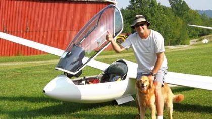 Tony Smolder of Greensburg is greeted by his dog, Teddy, after flying for five hours around the Tri-State area.