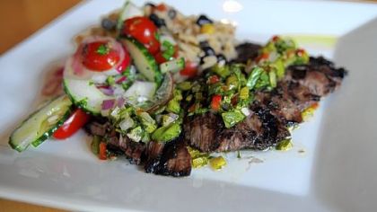 Bife steak chimichurri con gallo pinto (Argentina): Grilled marinated skirt steak topped with chimichurri with black beans and rice created by Chef Martin Lamarche, Alma, a new Pan-Latin American restaurant in Regent Square.