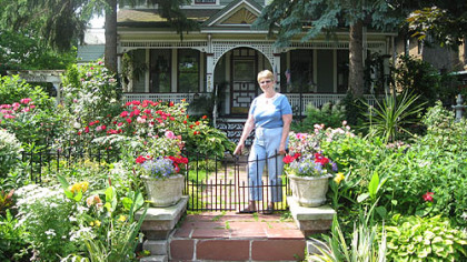 Jennifer Guercio at the entrance to her Victorian garden.