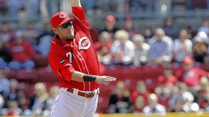 Jose Tabata steals second as Reds shortstop Paul Janish is pulled off the bag by a high throw in the second inning Sunday in Cincinnati.