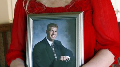Tammy Plevretes holds a photo of her son, Preston, at the family home in Marlboro, N.J., on Dec. 11, 2009.