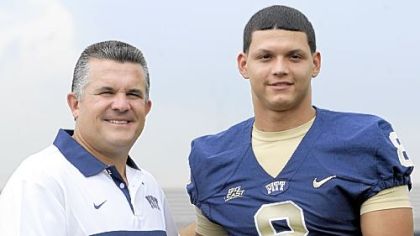 Pitt head coach Todd Graham poses with quarterback Anthony Gonzalez during media day Monday afternoon.