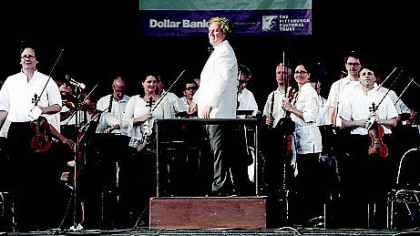 PSO music director Manfred Honeck (center) and musicians at the Three Rivers Arts Festival Sunday evening.