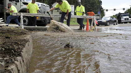 Pittsburgh Water and Sewer Authority (PWSA) crews clean storm drain catch basins along at Highland Dr. and Washington Blvd.