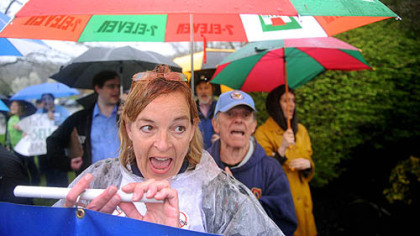 Jet Miskis of Peters chants as a group of protesters gather and march to Range Resources' Southpointe headquarters on Tuesday. The group called for a gas extraction tax to help reduce state cuts in education.