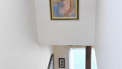 Art of the artist's children hangs in the stairwell.