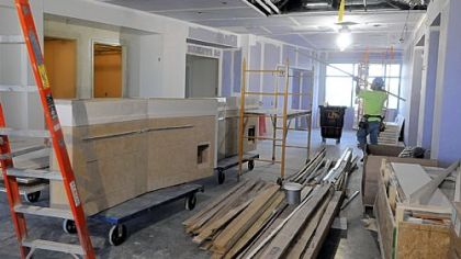 Workers continue to build in the family area on one of the floors of the new UPMC East hospital.