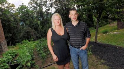 Michael and Erin Masula outside their home in Kilbuck Wednesday. Mr. Masula has been diagnosed with Fabry disease, and the treatment, Fabrazyme, is being rationed due to supply problems.