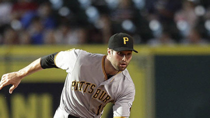 Pirates second baseman Neil Walker makes a play on a ground ball against the Astros at Minute Maid Park in Houston Wednesday.