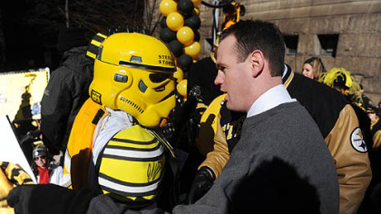 Pittsburgh Mayor Luke Ravenstahl congratulates the Steel City Storm Trooper for winning a costume contest.