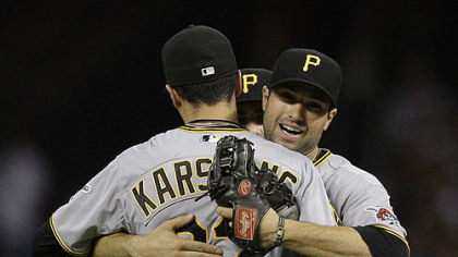 The Pirates' Jeff Karstens is congratulated by teammate Neil Walker after the final out against the Astros at Minute Maid Park in Houston Friday.