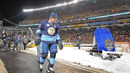 Sidney Crosby heads to locker room after losing to the Capitals in the Winter Classic at Heinz Field last night. Crosby was held scoreless for a second consecutive game.