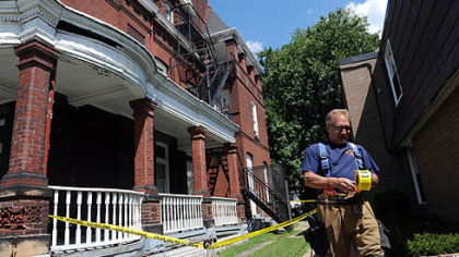 Pittsburgh firefighters from the Brighton Heights station cordon off an area next to 3532 California Ave. after an earthquake caused bricks to fall off of the structure.