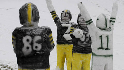 Life-sized football snowmen portraying the Steelers and the Jets play a few downs at Boyce Park in Monroeville.
