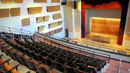 This view of the auditorium is from the balcony, where the original wooden chairs were refinished and recovered.