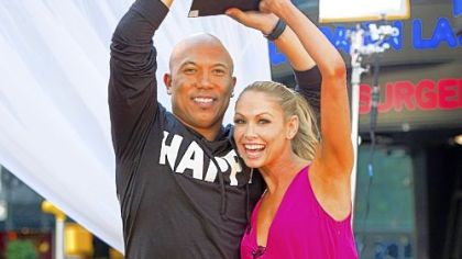 "Dancing With the Stars" winners Hines Ward and Kym Johnson show off the Mirrorball Trophy on Wednesday's "Good Morning America."