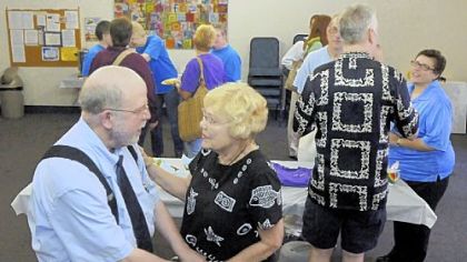 Retired pastor Don Steele visits with Verna Robinson at a reception at the Sixth Presbyterian Church following the Sunday morning service.