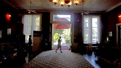 Lara Mann of Wilmette, Ill., walks through the lobby in the Athenaeum Hotel. Ms. Mann works as a gallery assistant.