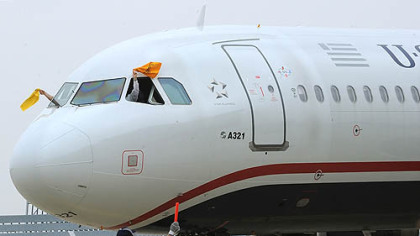 The Steelers arrived at Dallas Fort Worth International Airport on a US Airways charter flight as the pilot and co-pilot wave their Terrible Towels.