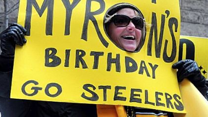 Julia Sarver, of North Versailles,  shows her support for the Steelers to win on Myron Cope's birthday during a rally at the county courthouse.