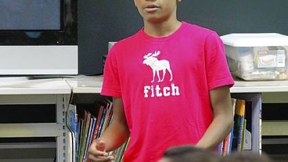 Tyree Walton ,13, makes a 30-second pitch for his "Lil Brother" clothing line, July 14, 2011, during a class held during a five-week daily business camp organized by the nonprofit group, Entrepreneuring Youth, at the Manchester Academic Charter School