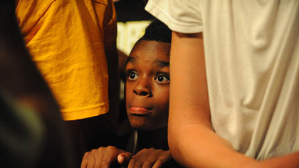 Amir Young, 10, waits for the start of the concert.