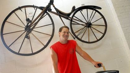 On the wall at Craig Morrow's Bicycle Heaven is an all-wood bike made in 1862.