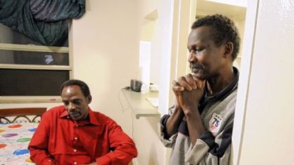 Ismail Omar, left, and fellow Darfurian Mohamed Idris, who live together in Castle Shannon, reflect on their lives and the referendum on southern Sudan's independence. Results of the vote will be announced Wednesday.