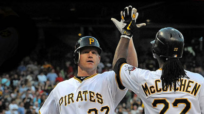 The Pirates' Lyle Overbay is greeted at home by Andrew McCutchen after hitting a three-run home run against the Red Sox at PNC Park Saturday.