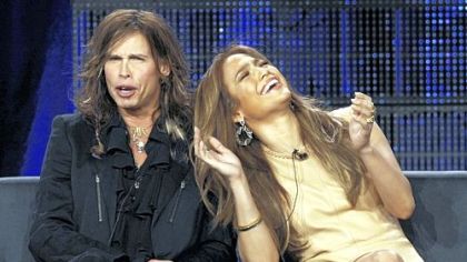 Steven Tyler and Jennifer Lopez, new judges on the Fox series "American Idol," participate in a panel discussion on the show at the Television Critics Association winter press tour in Pasadena, Calif., Tuesday.