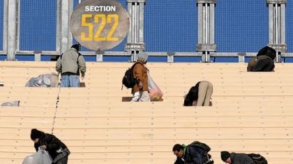 The Heinz Field cleanup crew tackles the upper deck Sunday morning as the stadium begins to return to normal after the National Hockey League's Winter Classic on New Year's night. Next up: a Steelers playoff game.