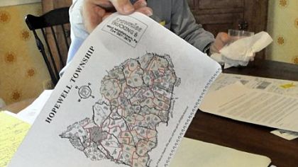 From his collection of documentation on gas leasing and drilling near his home, Paul Parker shows a map of gas leases in Hopewell.